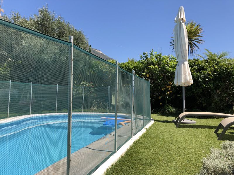 Mesh Pool Safety Fence in Backyard